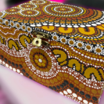 A close-up image of a painted jewellery box