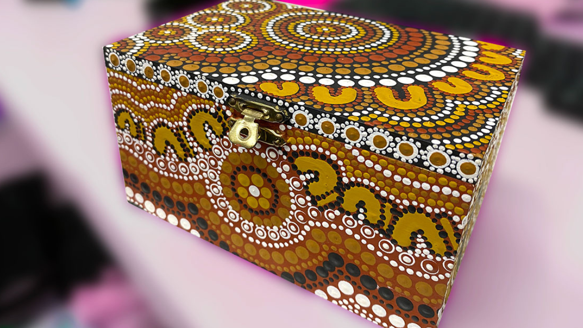 A close-up image of a painted jewellery box
